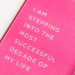 a pink notebook with a quote on it