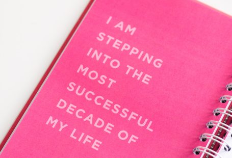 a pink notebook with a quote on it