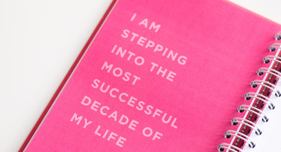 a pink notebook with a quote on it