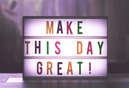 Inspirational sign displaying 'Make This Day Great' in colorful letters.